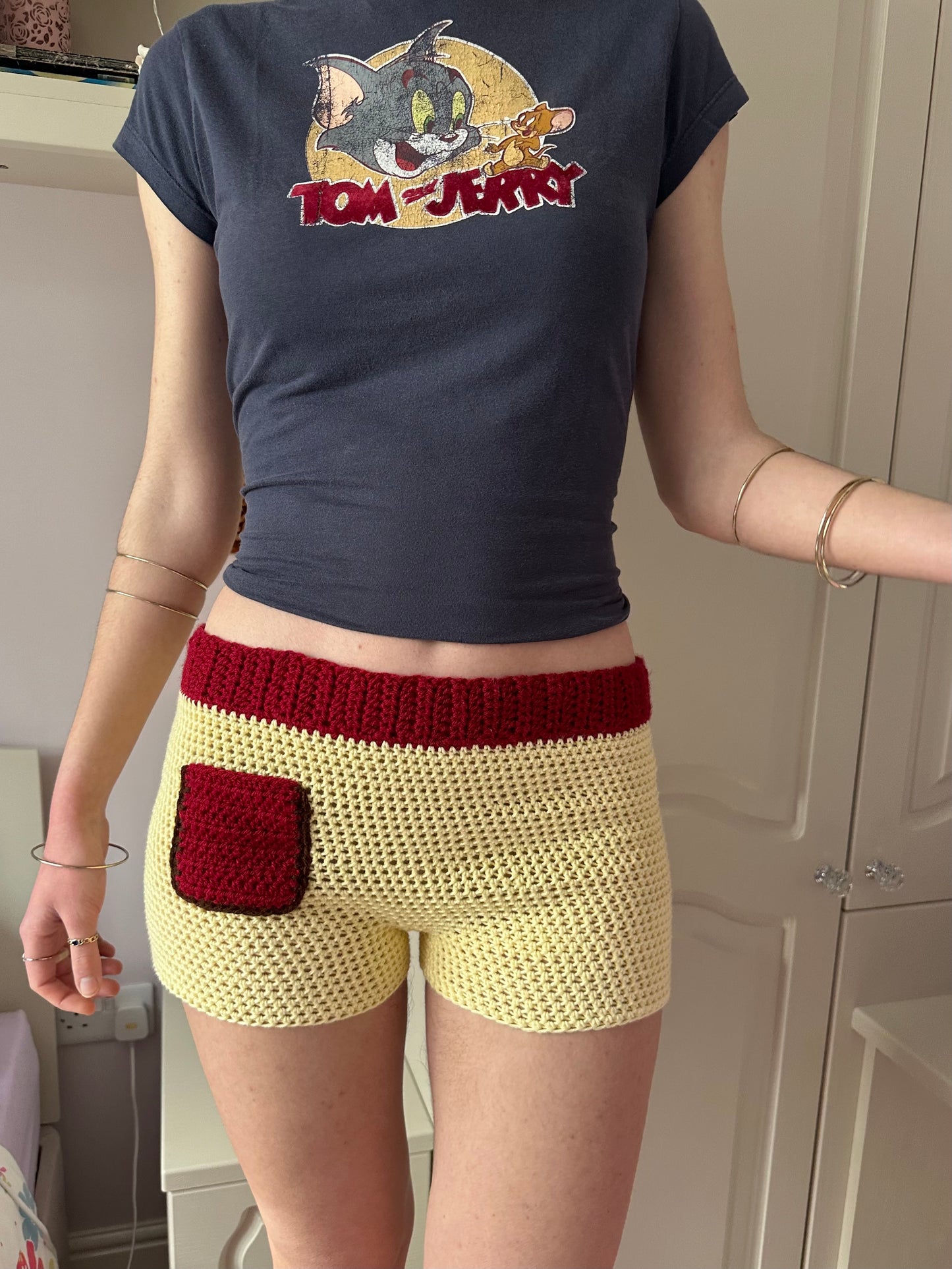 Handmade crochet shorts in pastel yellow, dark red and brown with pocket