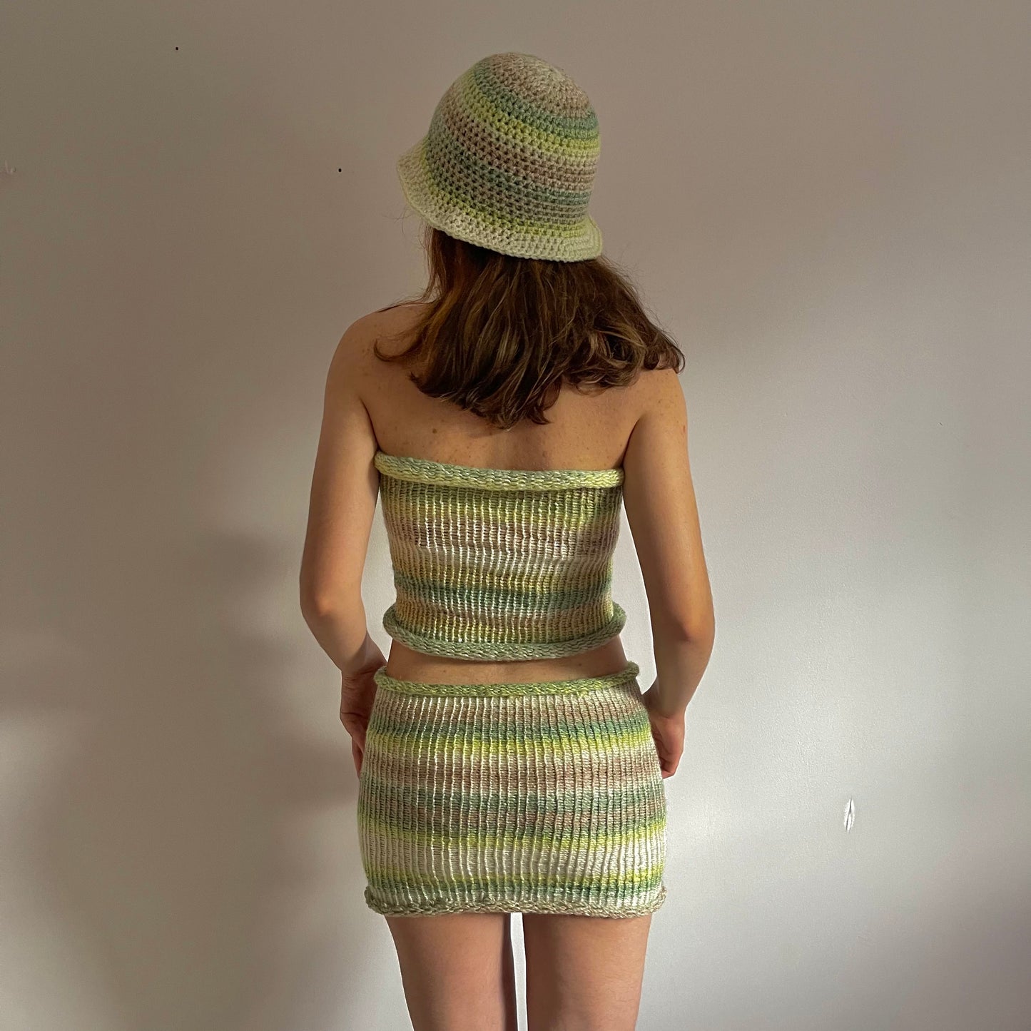 Handmade knitted mini skirt in green, beige and cream