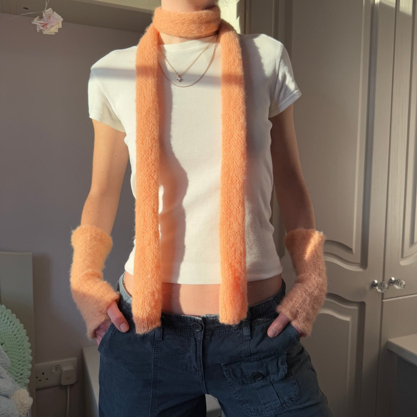 Handmade knitted mohair skinny scarf in light orange