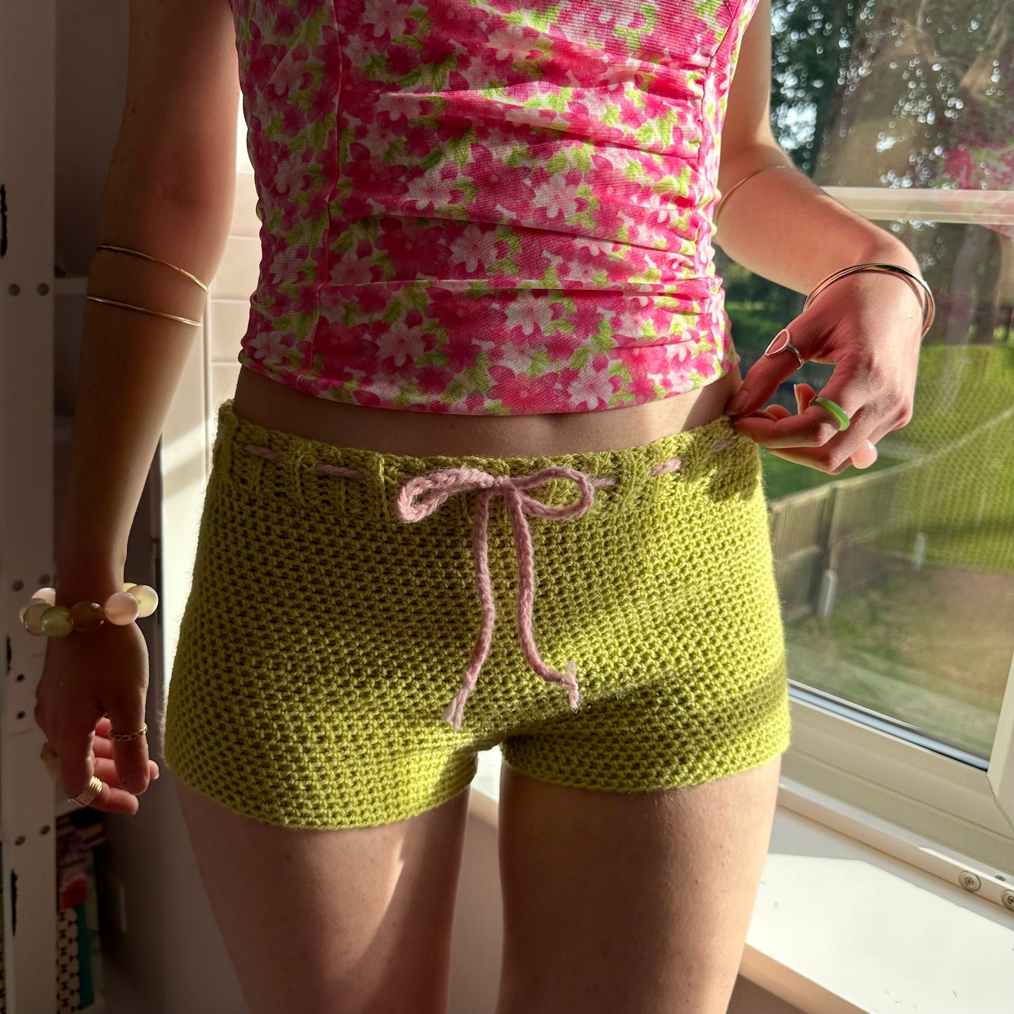 Handmade chartreuse crochet shorts with baby pink bow