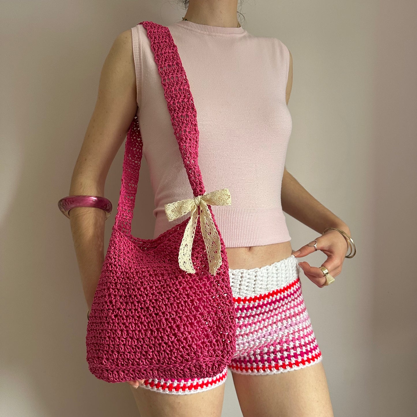 Handmade hot pink crochet straw bag with cream lace bow - can also be worn crossbody