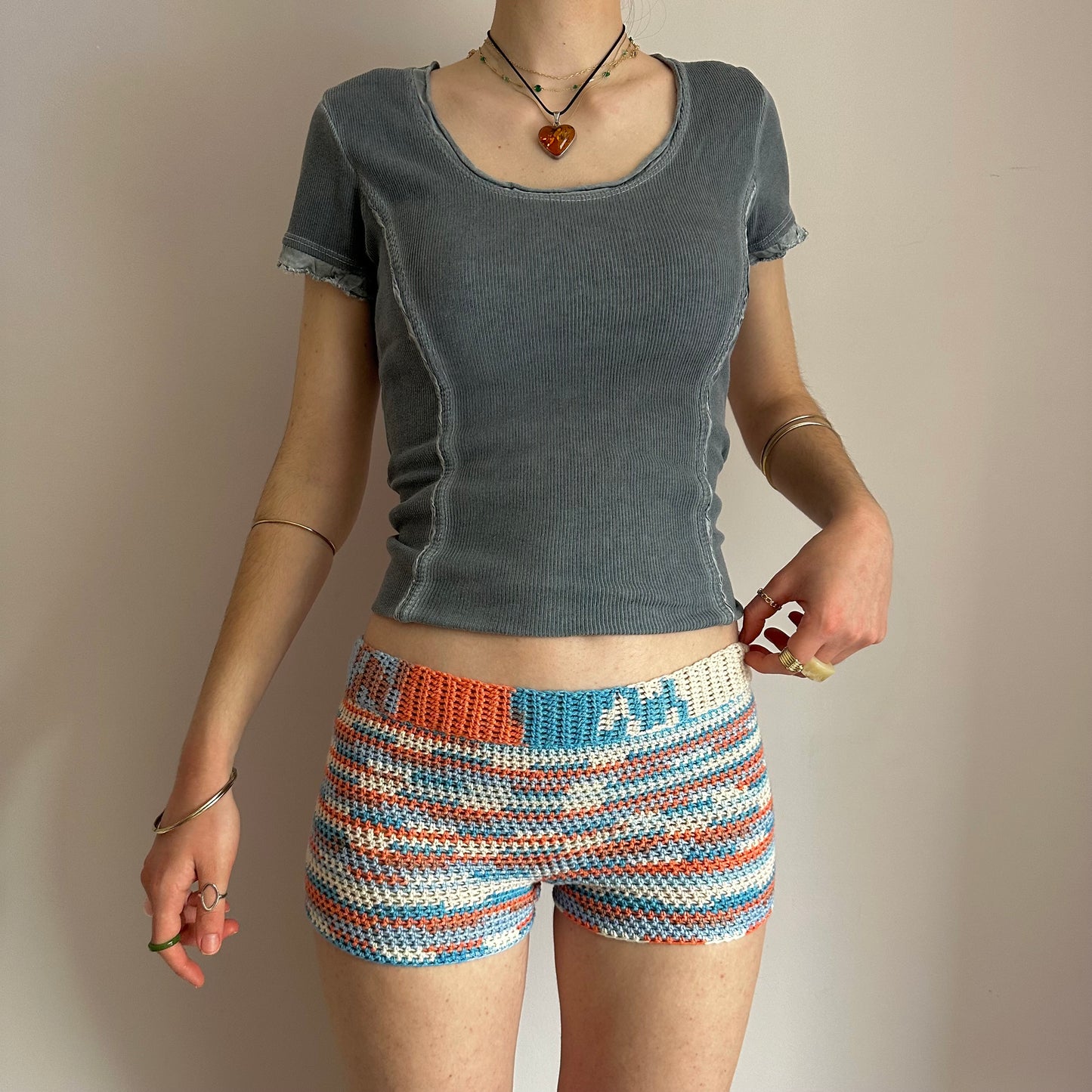 Handmade orange, white and blue striped crochet shorts