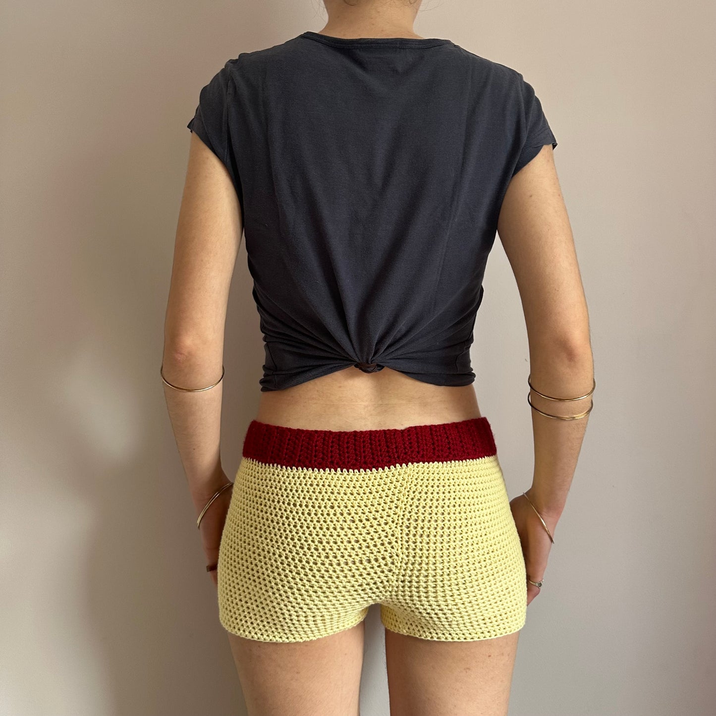 Handmade crochet shorts in pastel yellow, dark red and brown with pocket