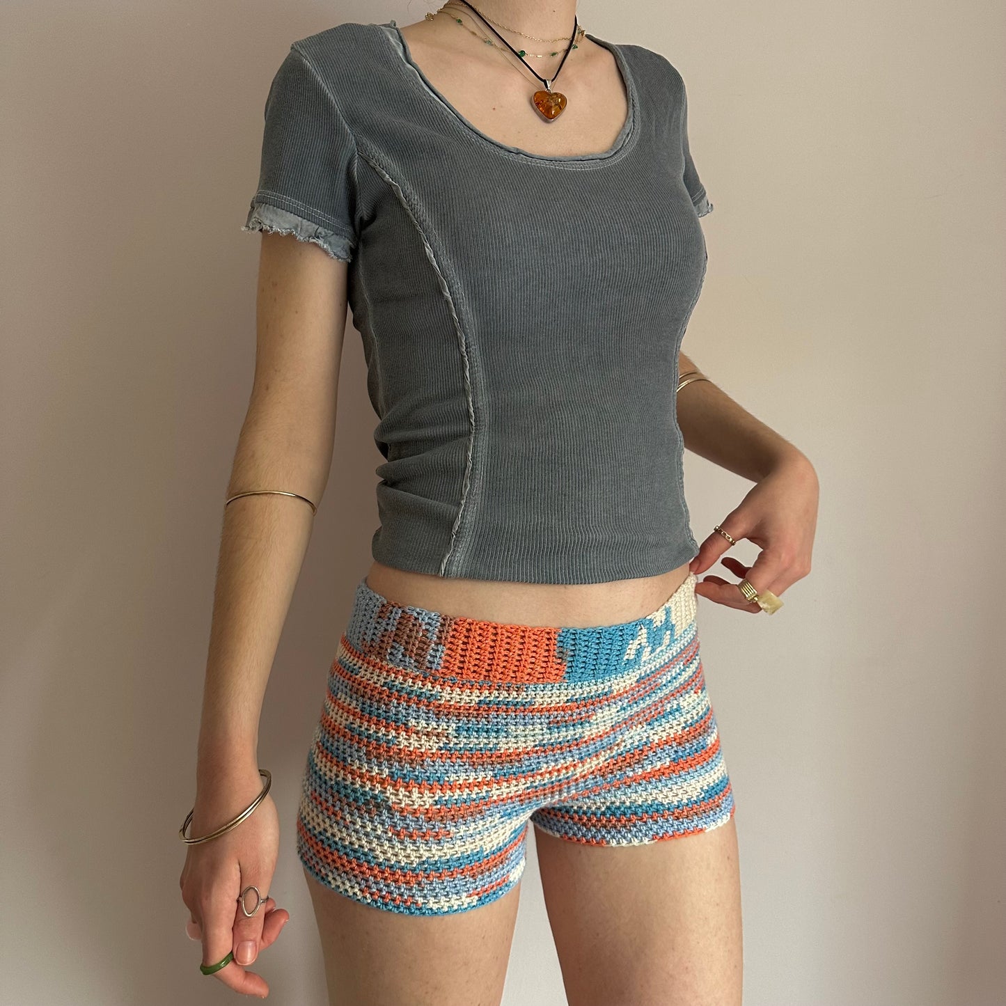 Handmade orange, white and blue striped crochet shorts