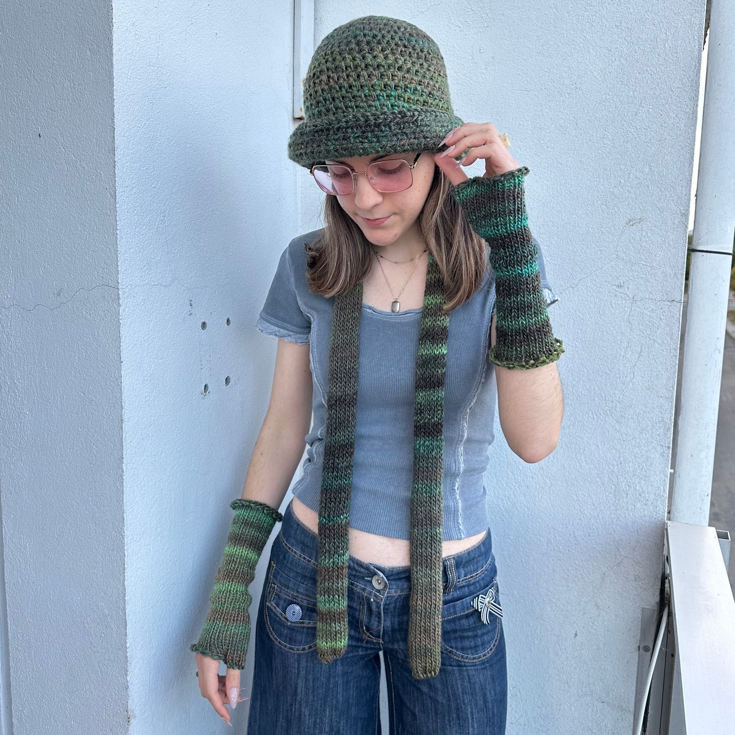 Handmade knitted ombré green hand warmers