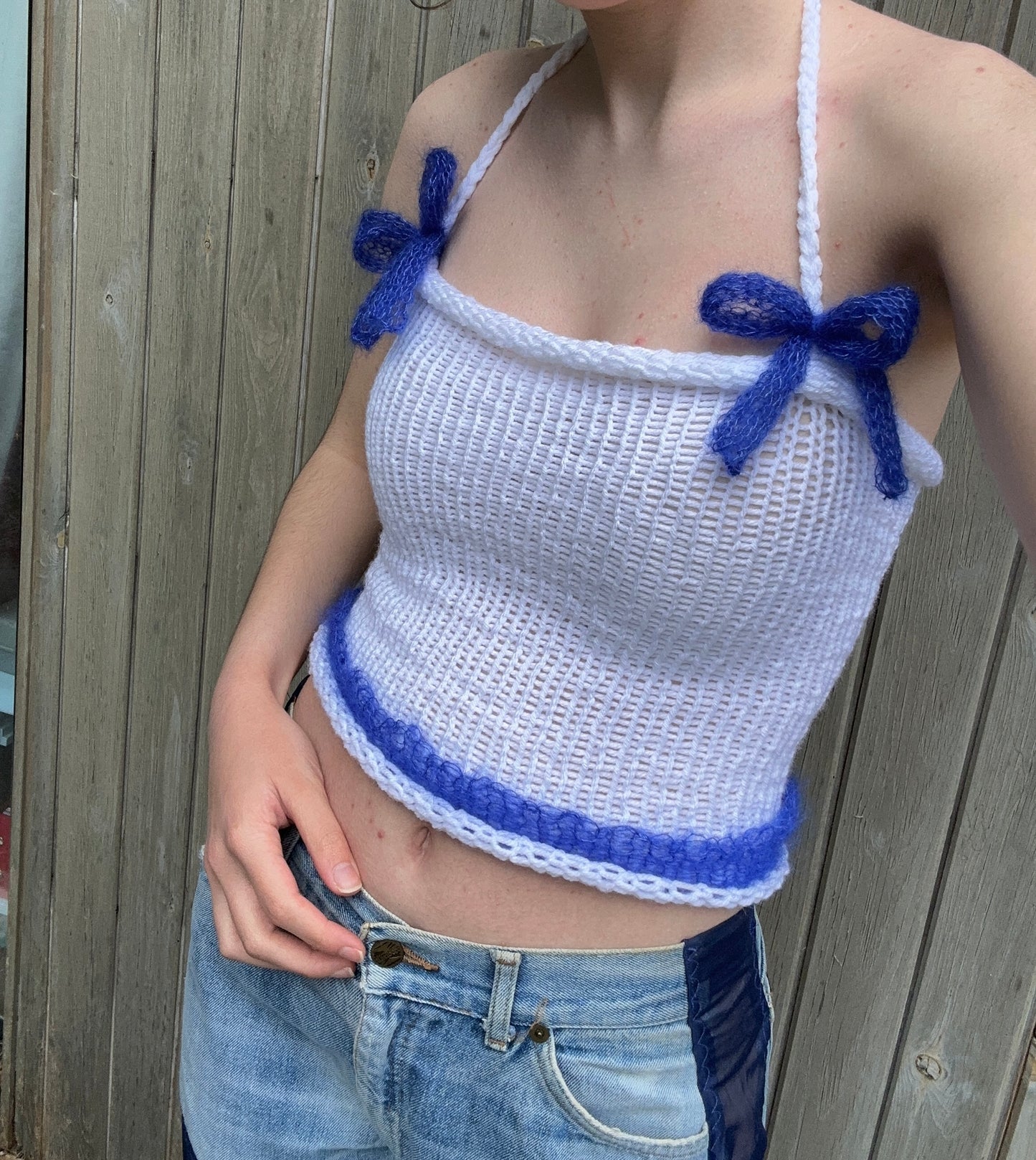 Handmade knitted mohair bow top in white and cobalt blue