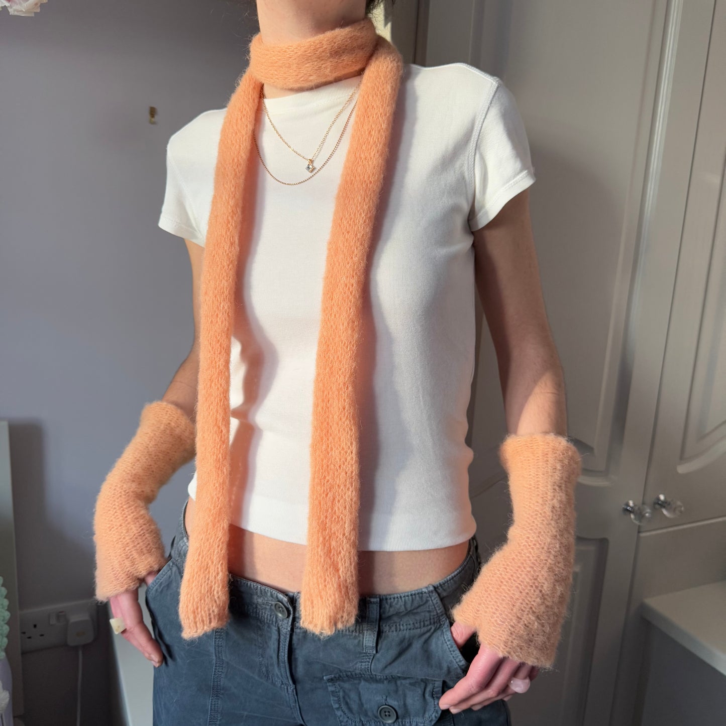 Handmade knitted mohair skinny scarf in light orange