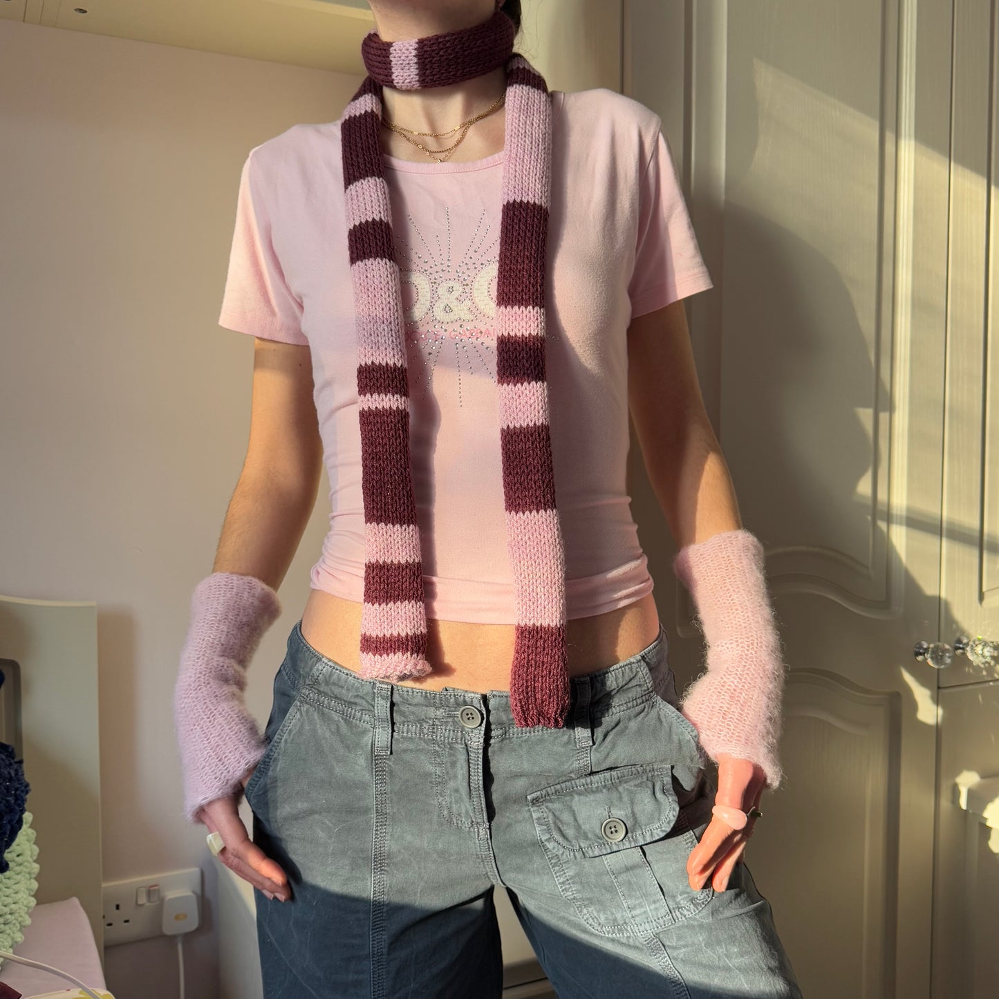 Handmade knitted stripy skinny scarf in maroon and dusky pink