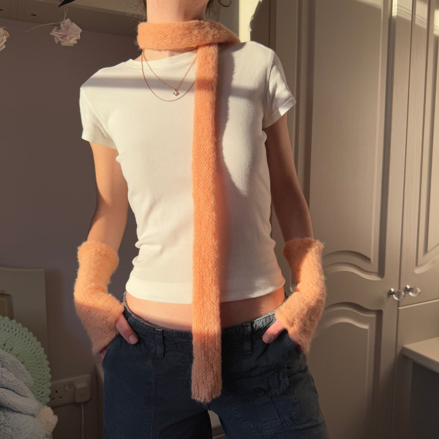 Handmade knitted mohair skinny scarf in light orange