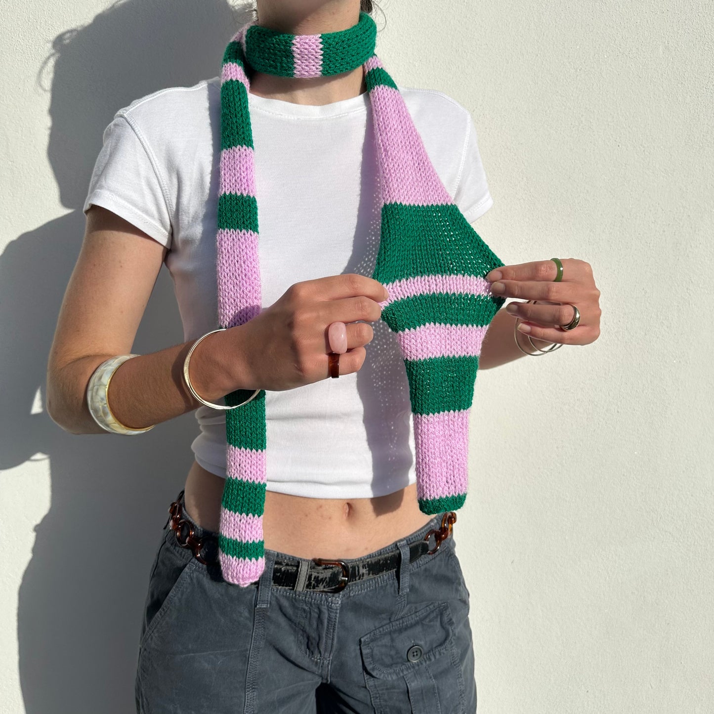 Handmade knitted stripy skinny scarf in baby pink and green