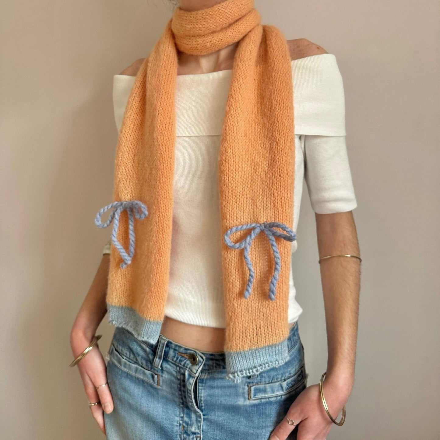 Handmade knitted orange and baby blue mohair bow scarf