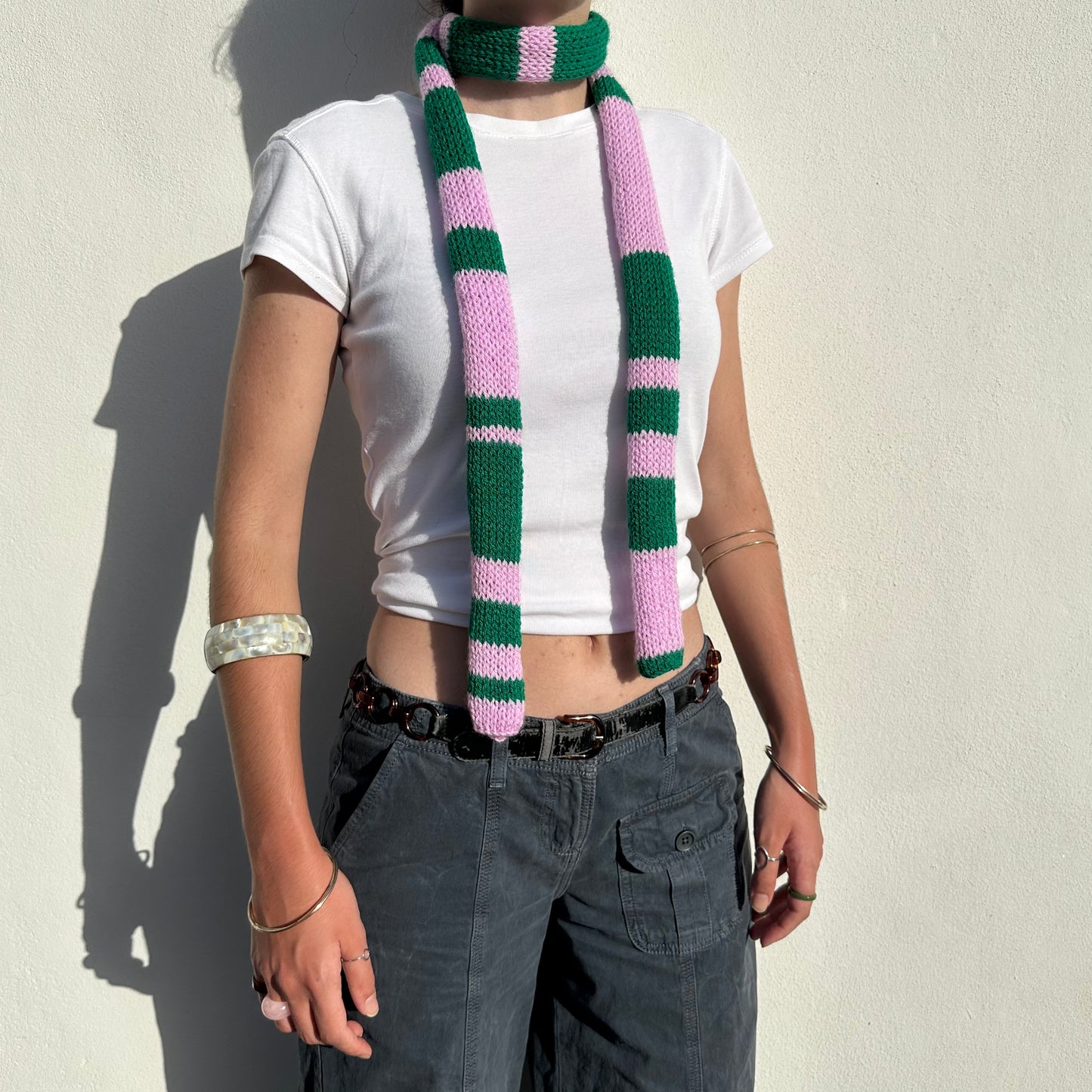 Handmade knitted stripy skinny scarf in baby pink and green