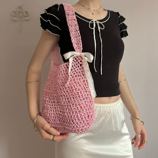 Handmade baby pink crochet straw bag with white lace bow