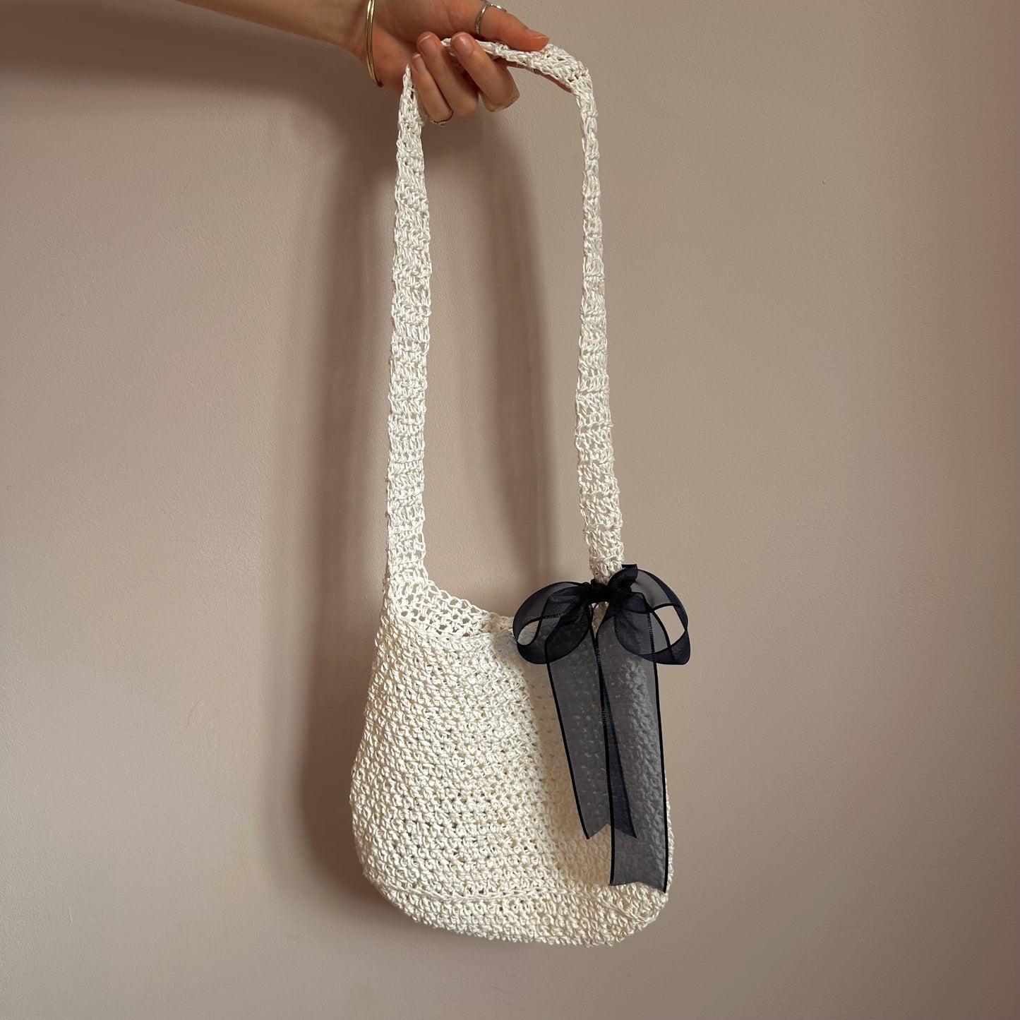 Handmade cream crochet straw bag with navy blue bow - can also be worn crossbody