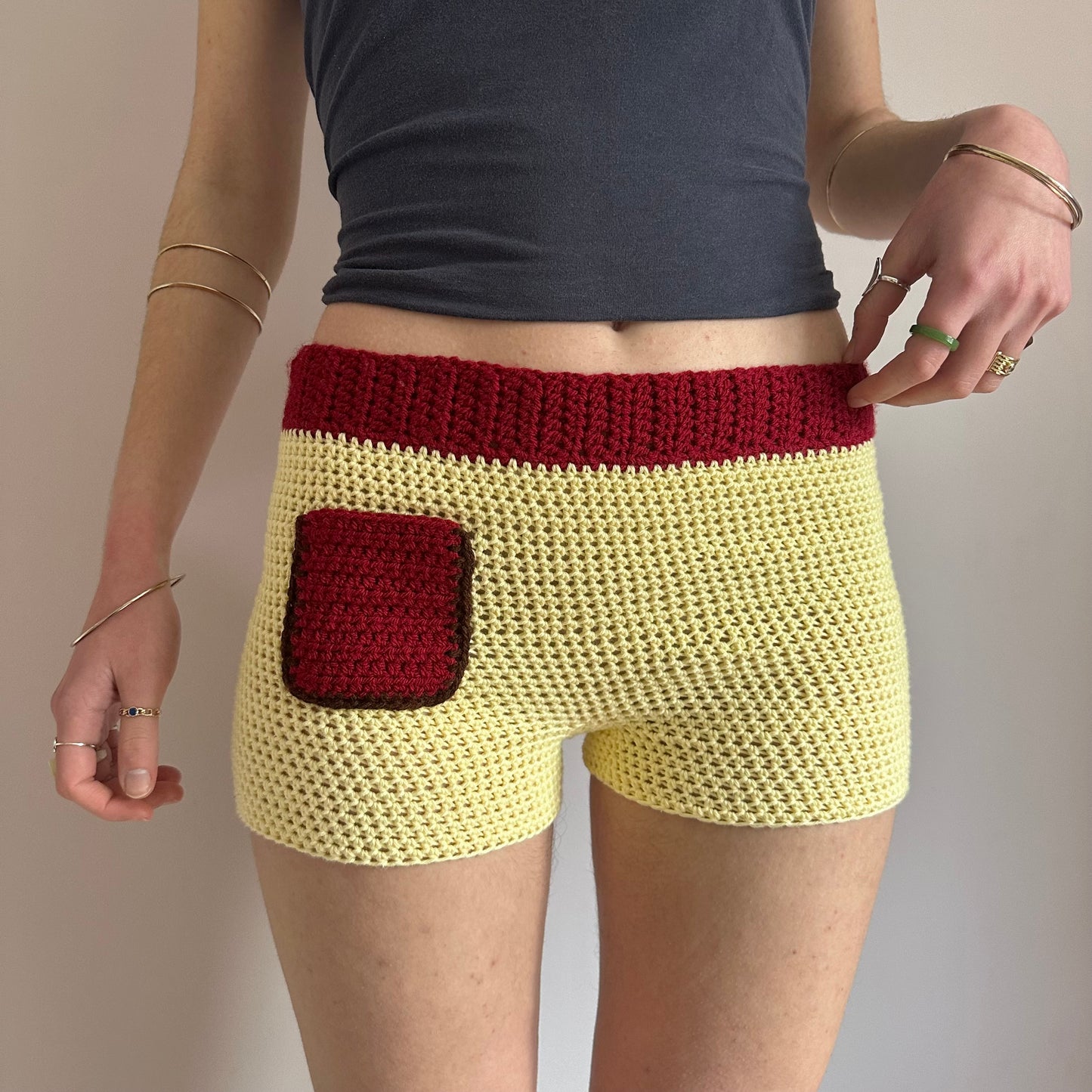 Handmade crochet shorts in pastel yellow, dark red and brown with pocket