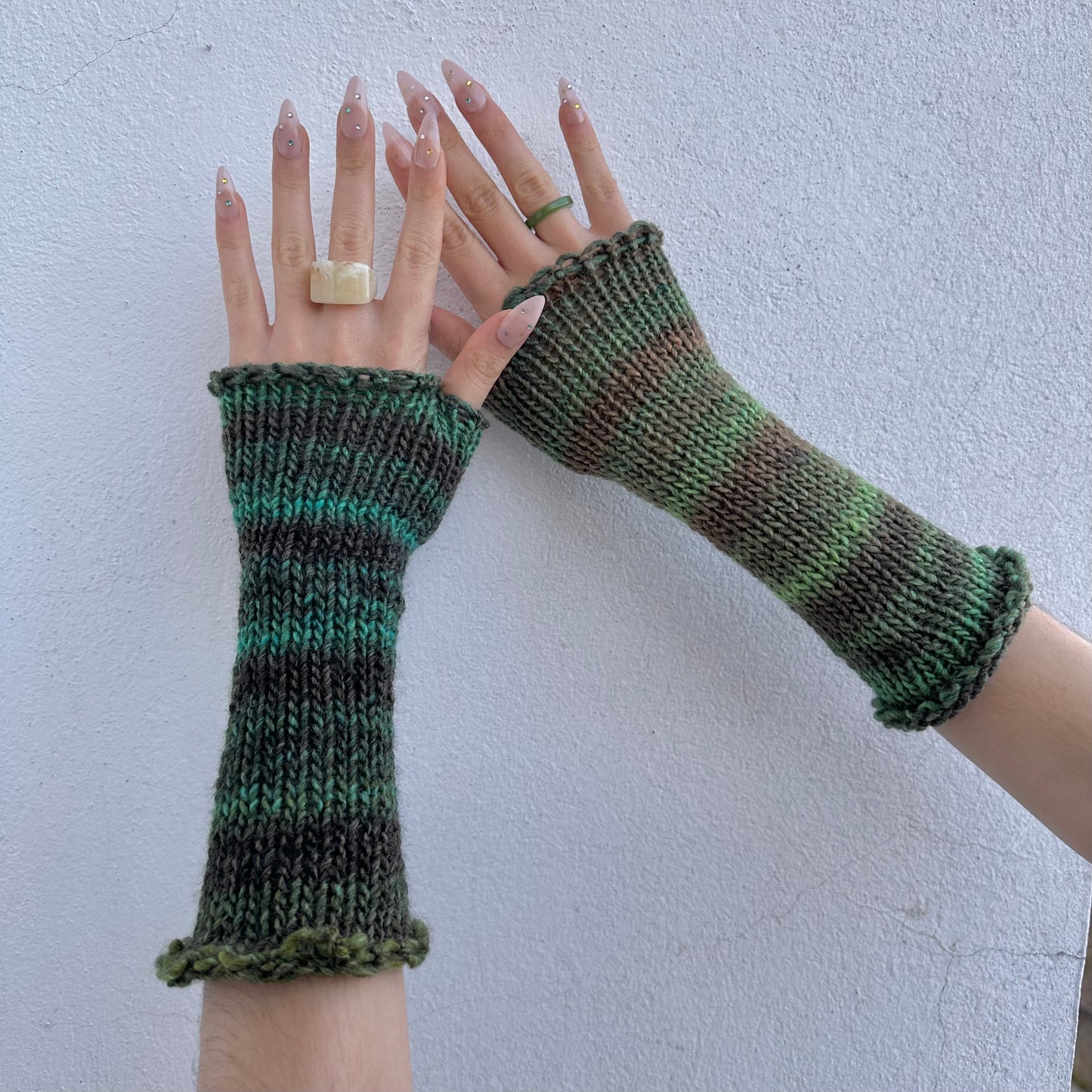 Handmade knitted ombré green hand warmers