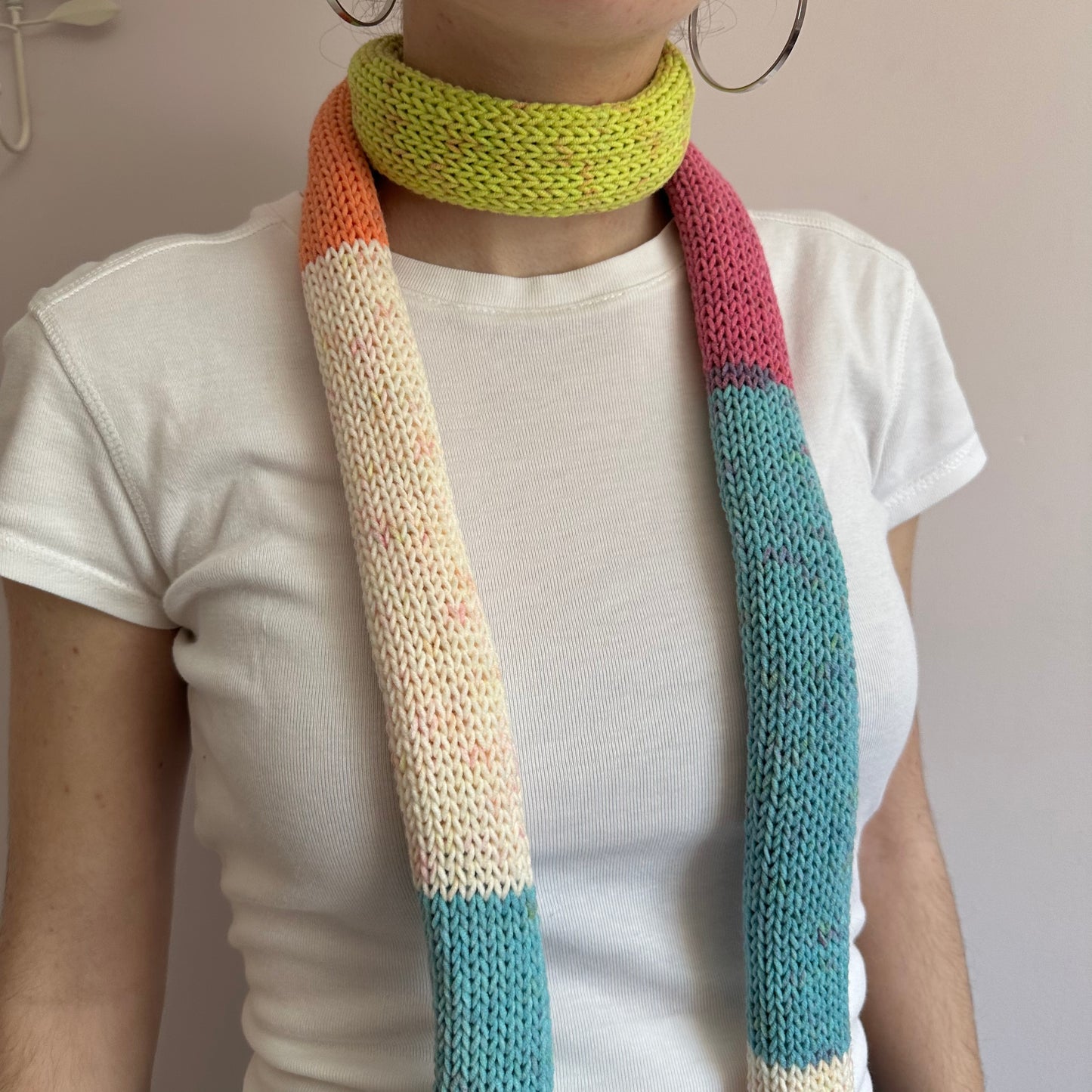Handmade knitted colour block skinny scarf in blue, cream, orange, pink and green