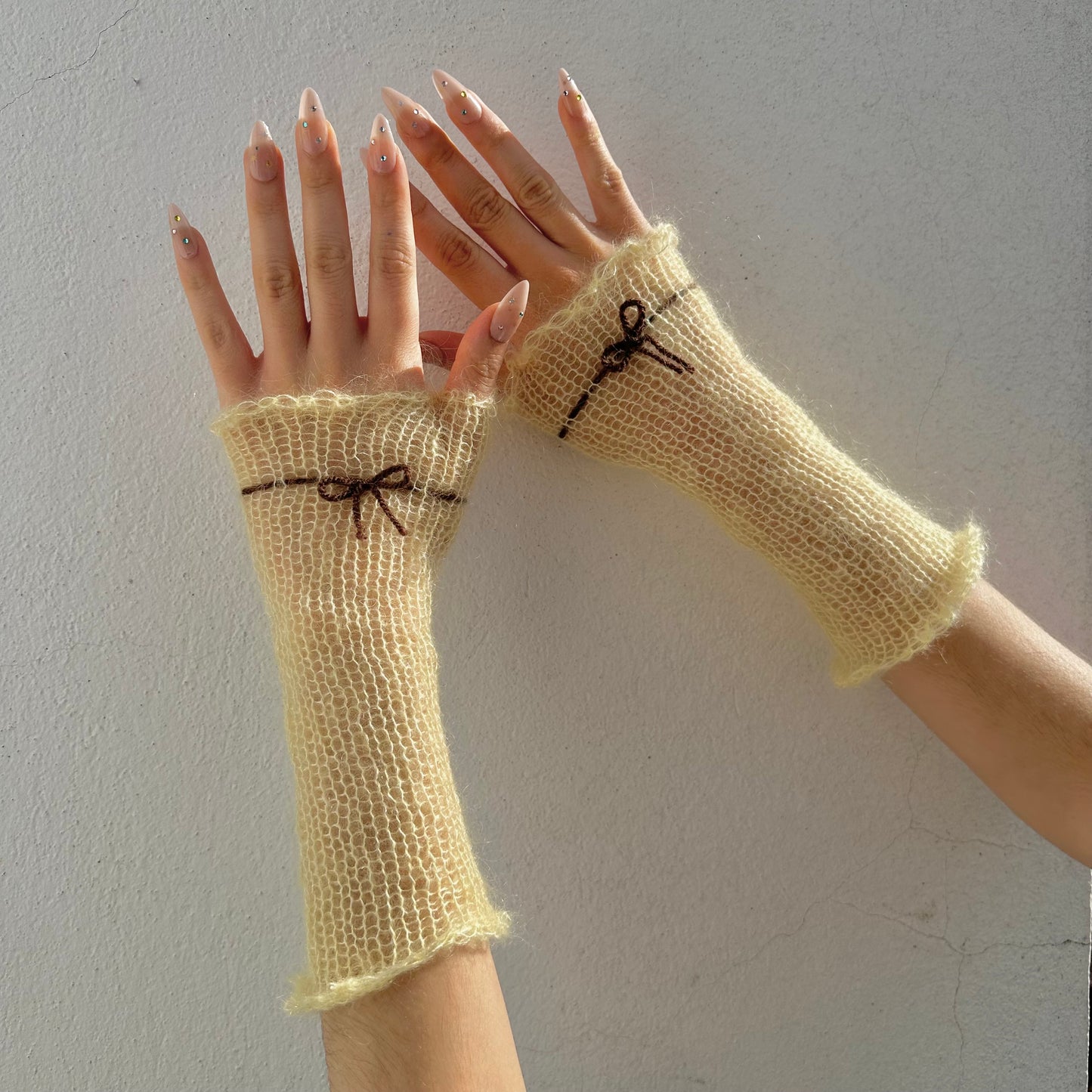 Handmade knitted mohair hand warmers in light yellow and brown - with thumb hole