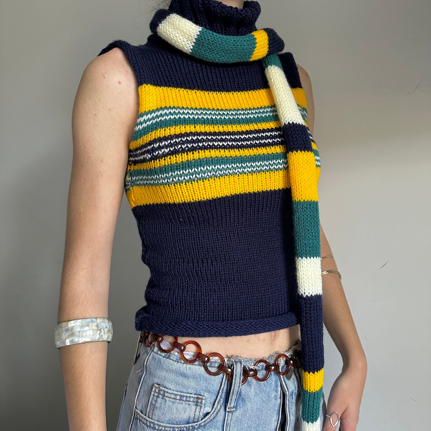 Handmade knitted stripy skinny scarf in navy, cream, yellow and teal