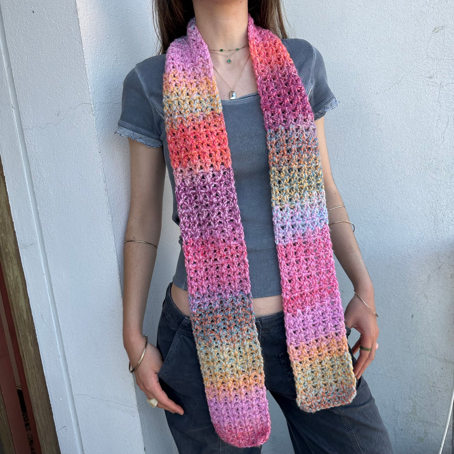 Handmade multicoloured ombré crochet scarf in pink, purple, orange and yellow