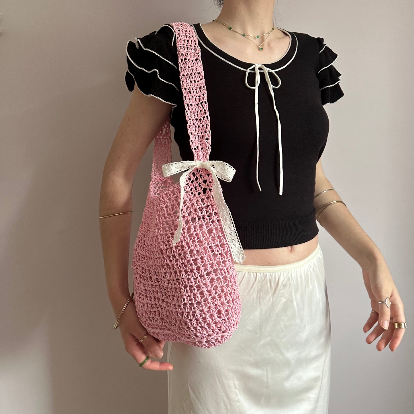 Handmade baby pink crochet straw bag with white lace bow