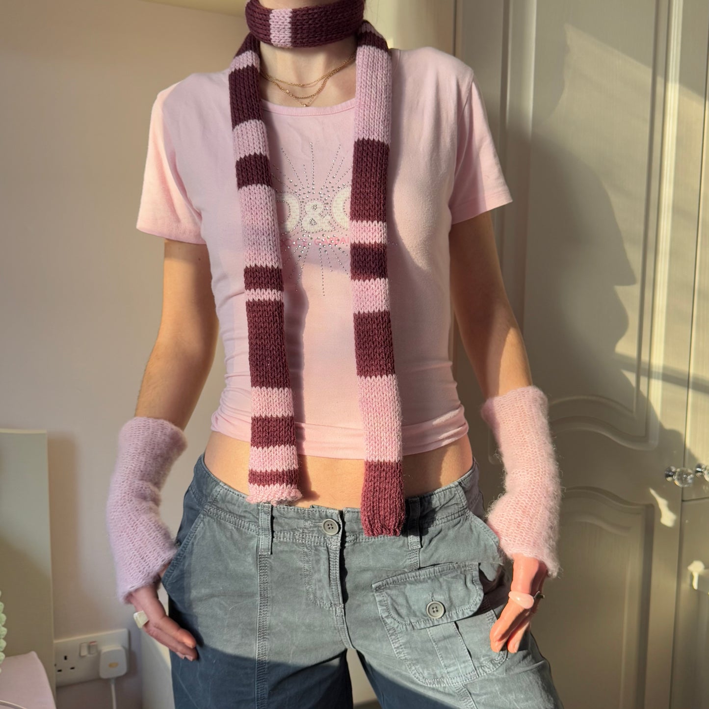 Handmade knitted stripy skinny scarf in maroon and dusky pink