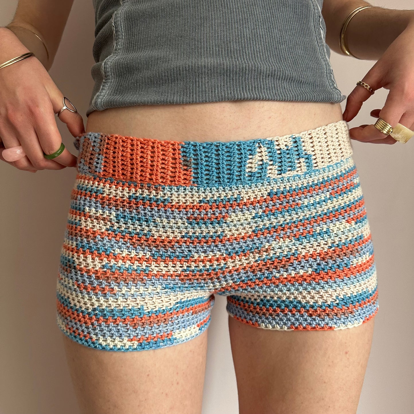 Handmade orange, white and blue striped crochet shorts