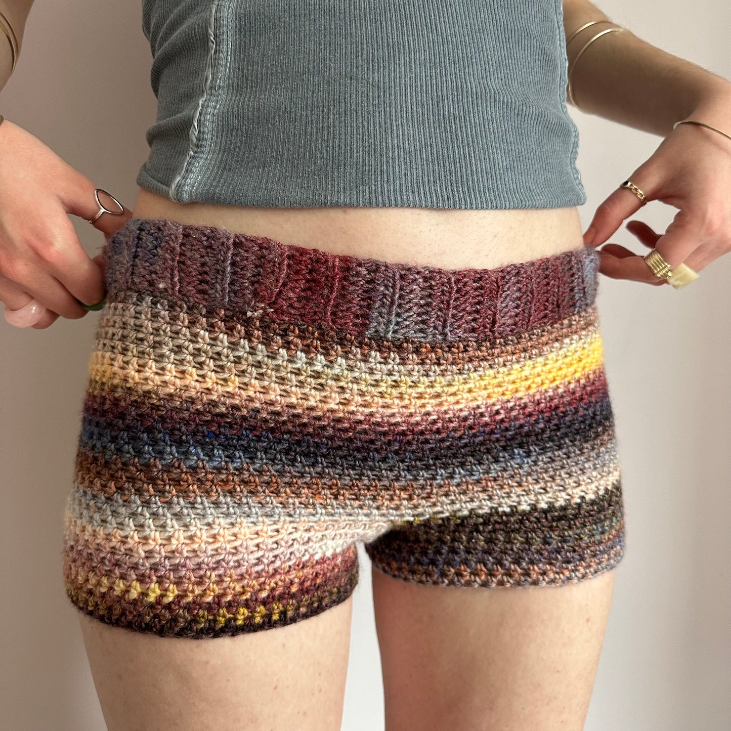 Handmade yellow, black, cream and burgundy ombré striped crochet shorts