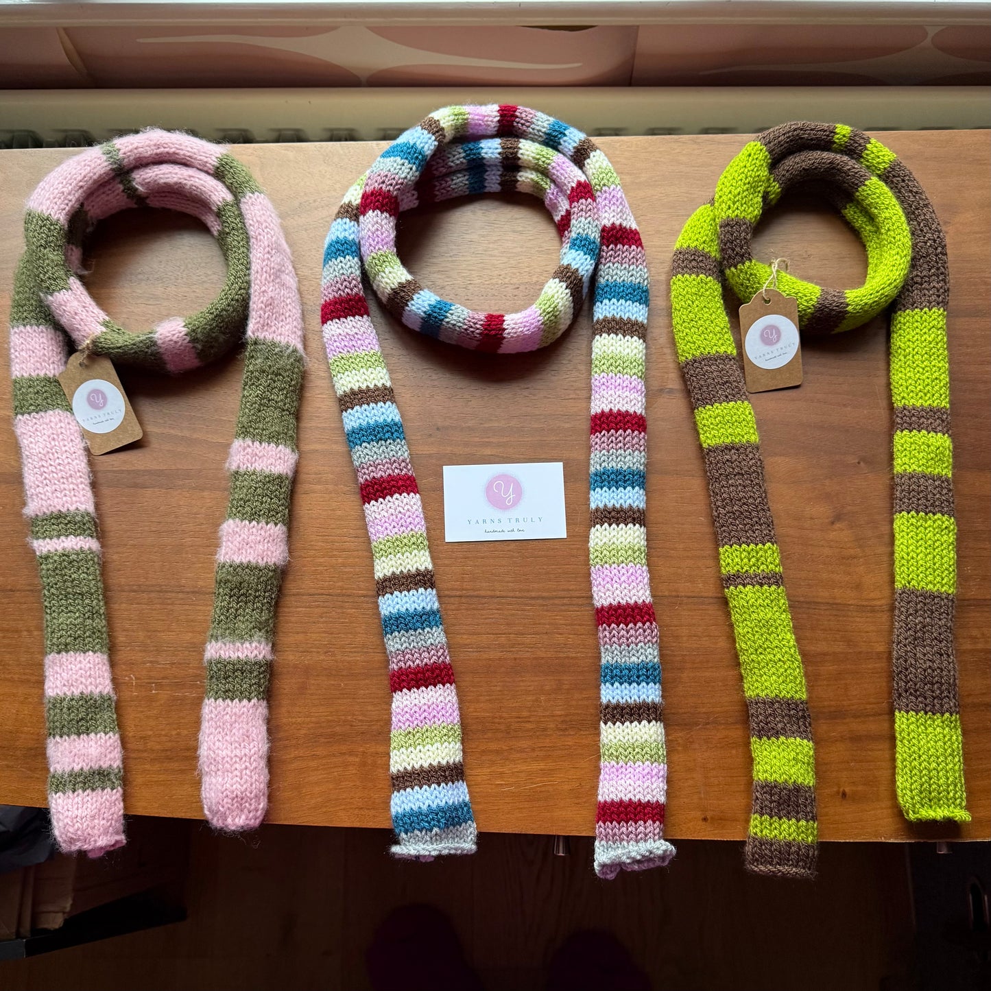 Handmade knitted stripy skinny scarf in dusky pink and khaki green