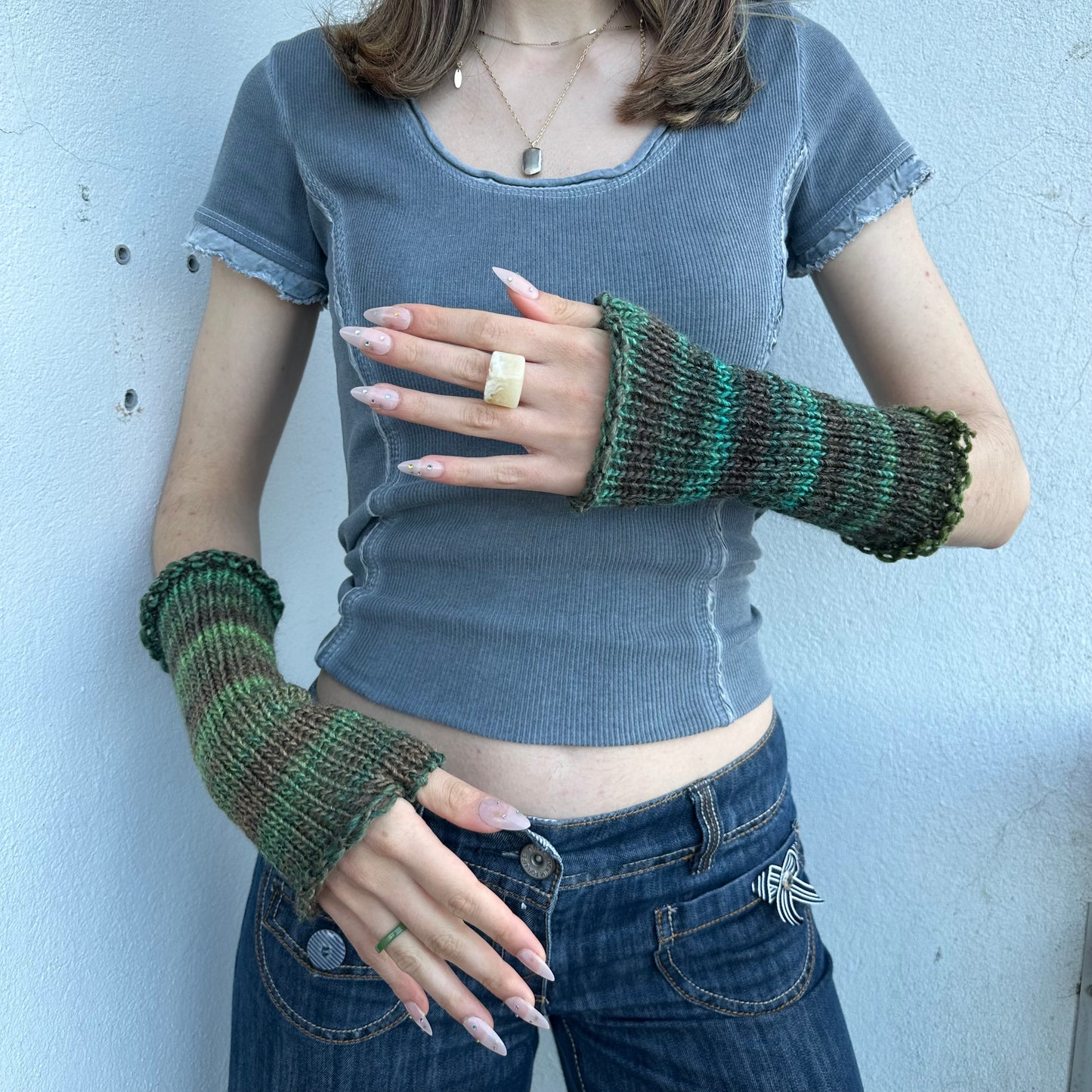 Handmade knitted ombré green hand warmers