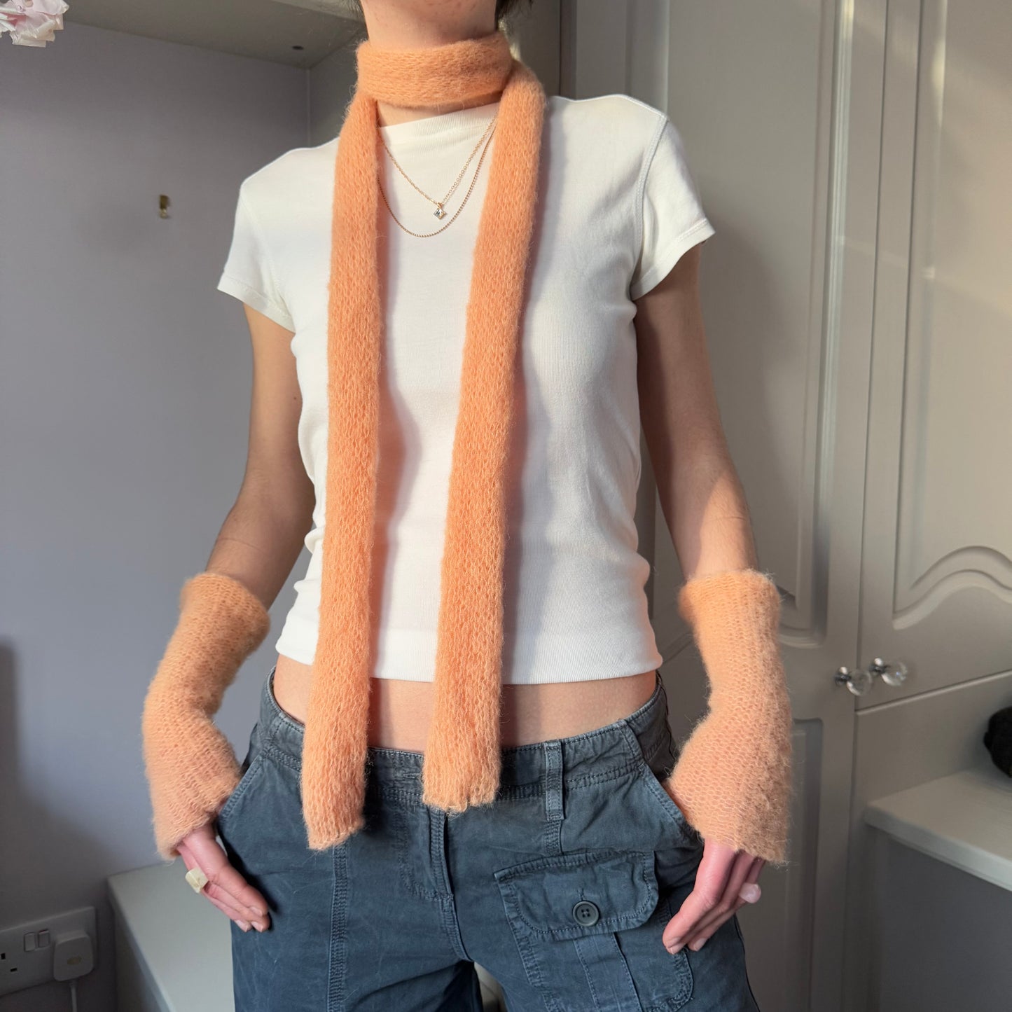 Handmade knitted mohair skinny scarf in light orange