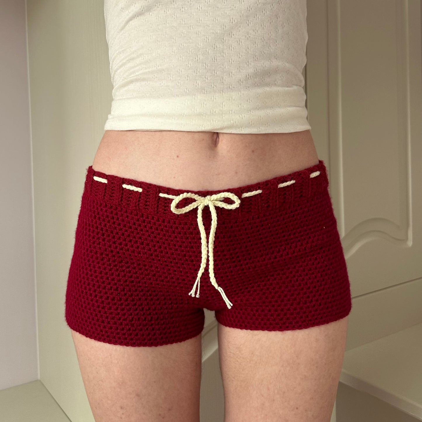 Handmade dark red crochet shorts with cream bow