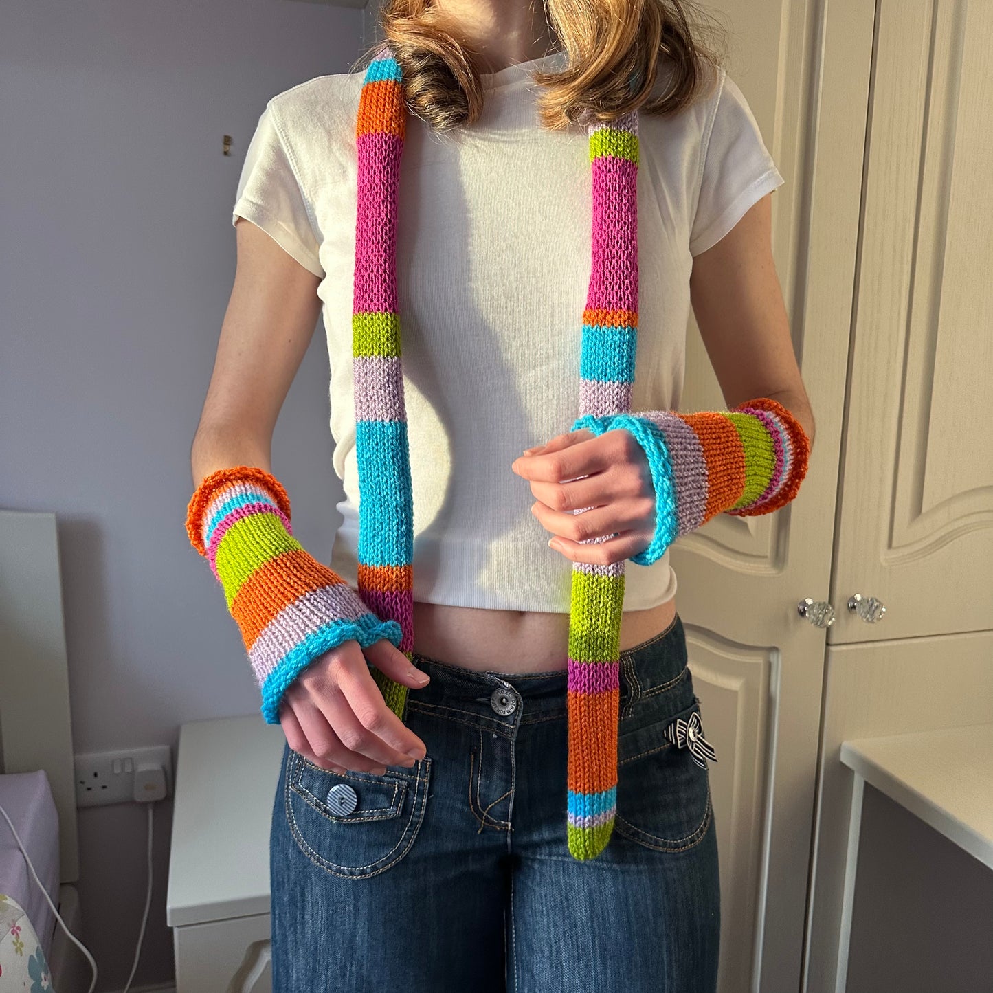Handmade knitted rainbow striped hand warmers