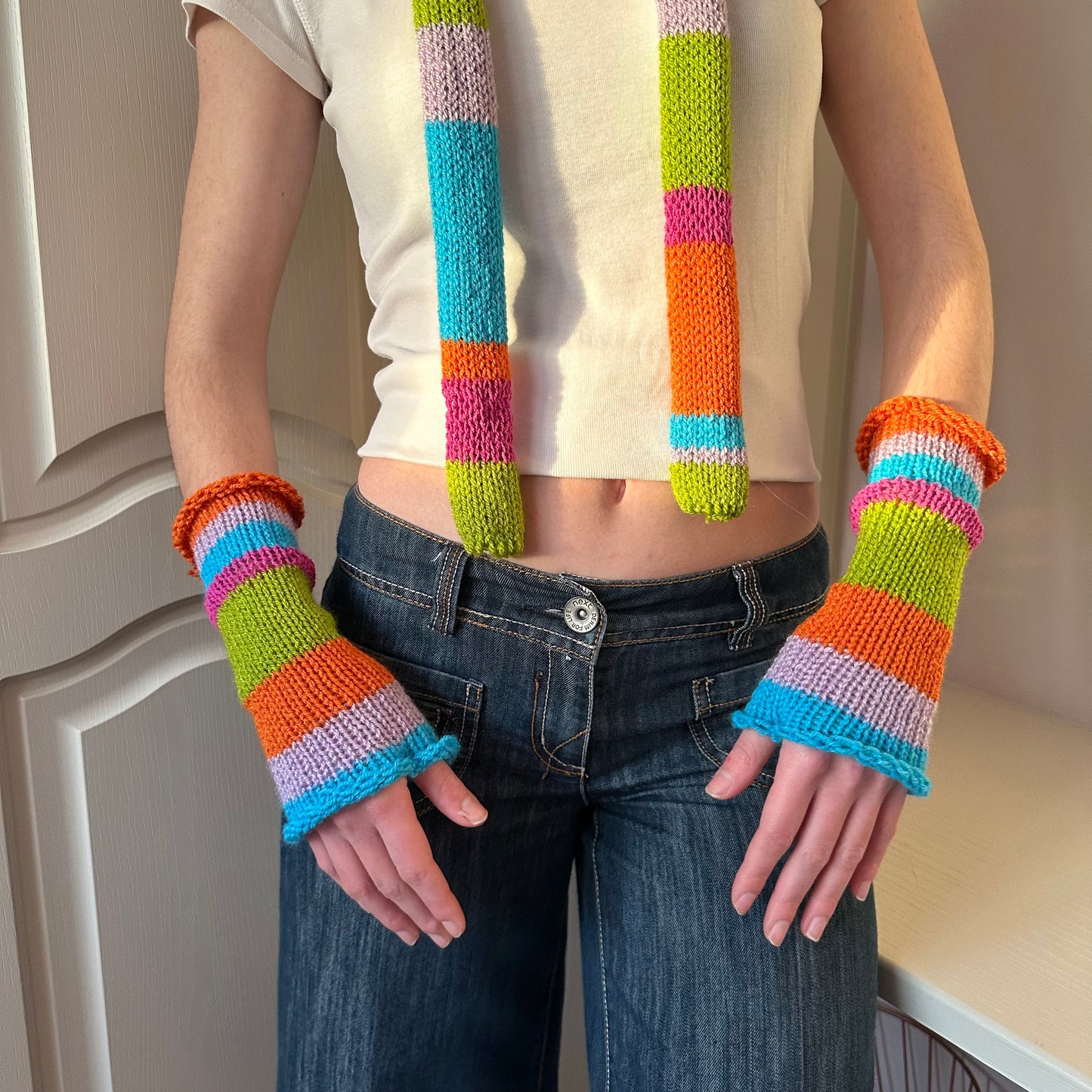 Handmade knitted rainbow striped hand warmers