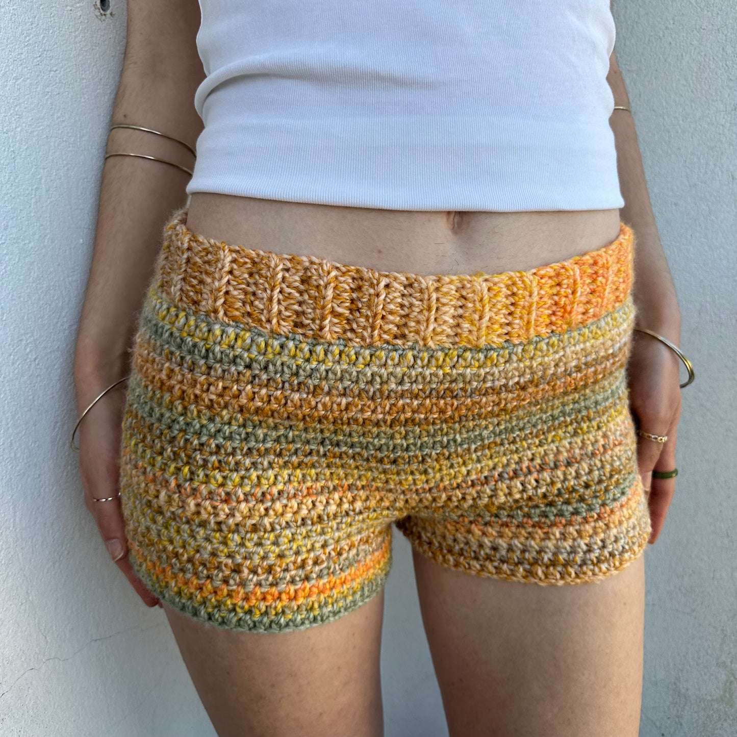 Handmade grey, yellow and orange ombré striped crochet shorts