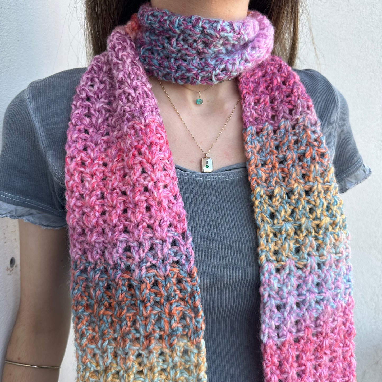 Handmade multicoloured ombré crochet scarf in pink, purple, orange and yellow