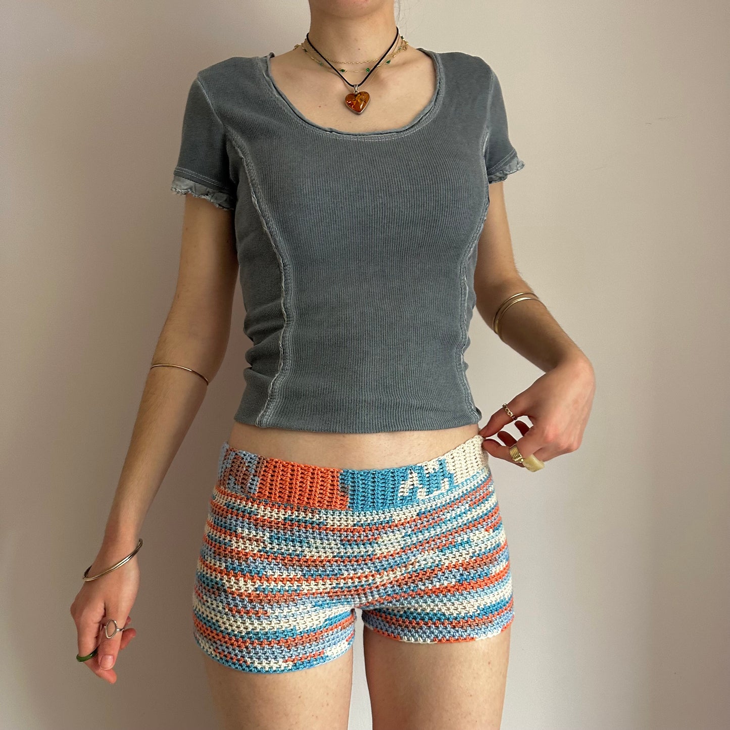 Handmade orange, white and blue striped crochet shorts