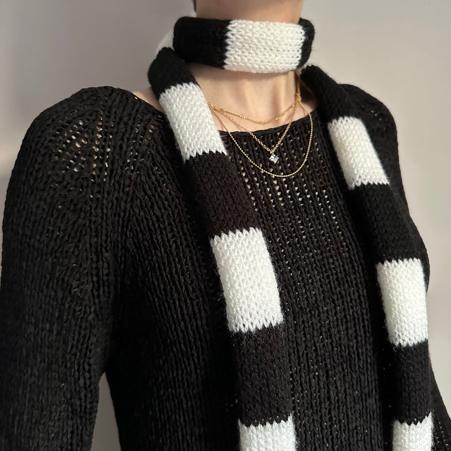 Handmade knitted striped skinny scarf in black and white