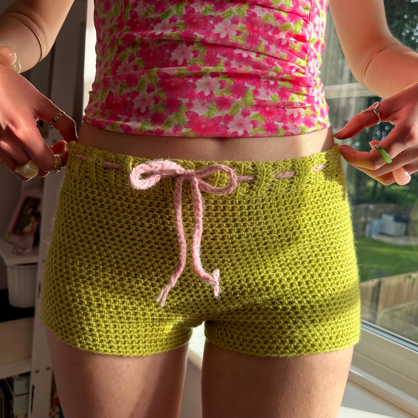 Handmade chartreuse crochet shorts with baby pink bow