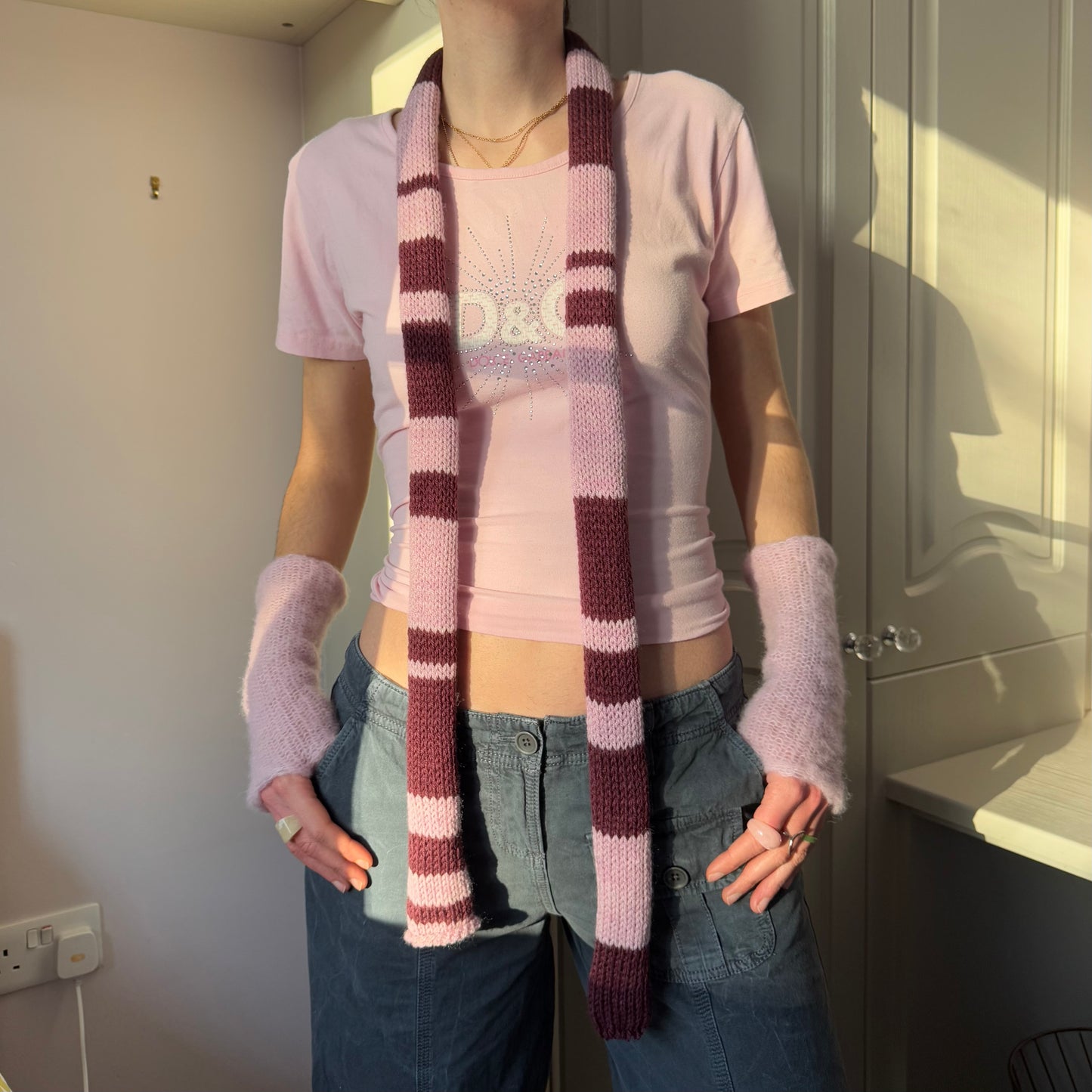 Handmade knitted stripy skinny scarf in maroon and dusky pink