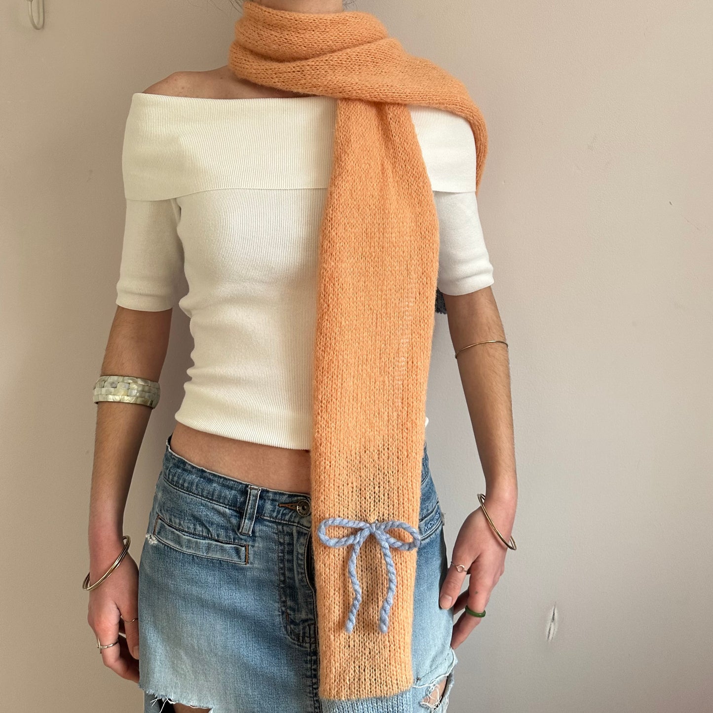 Handmade knitted orange and baby blue mohair bow scarf