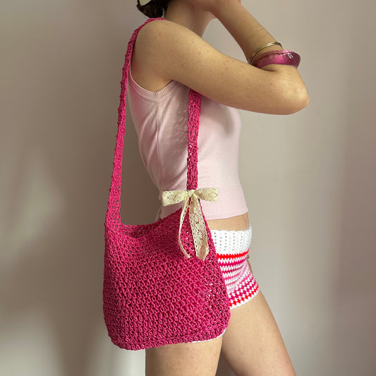 Handmade hot pink crochet straw bag with cream lace bow - can also be worn crossbody