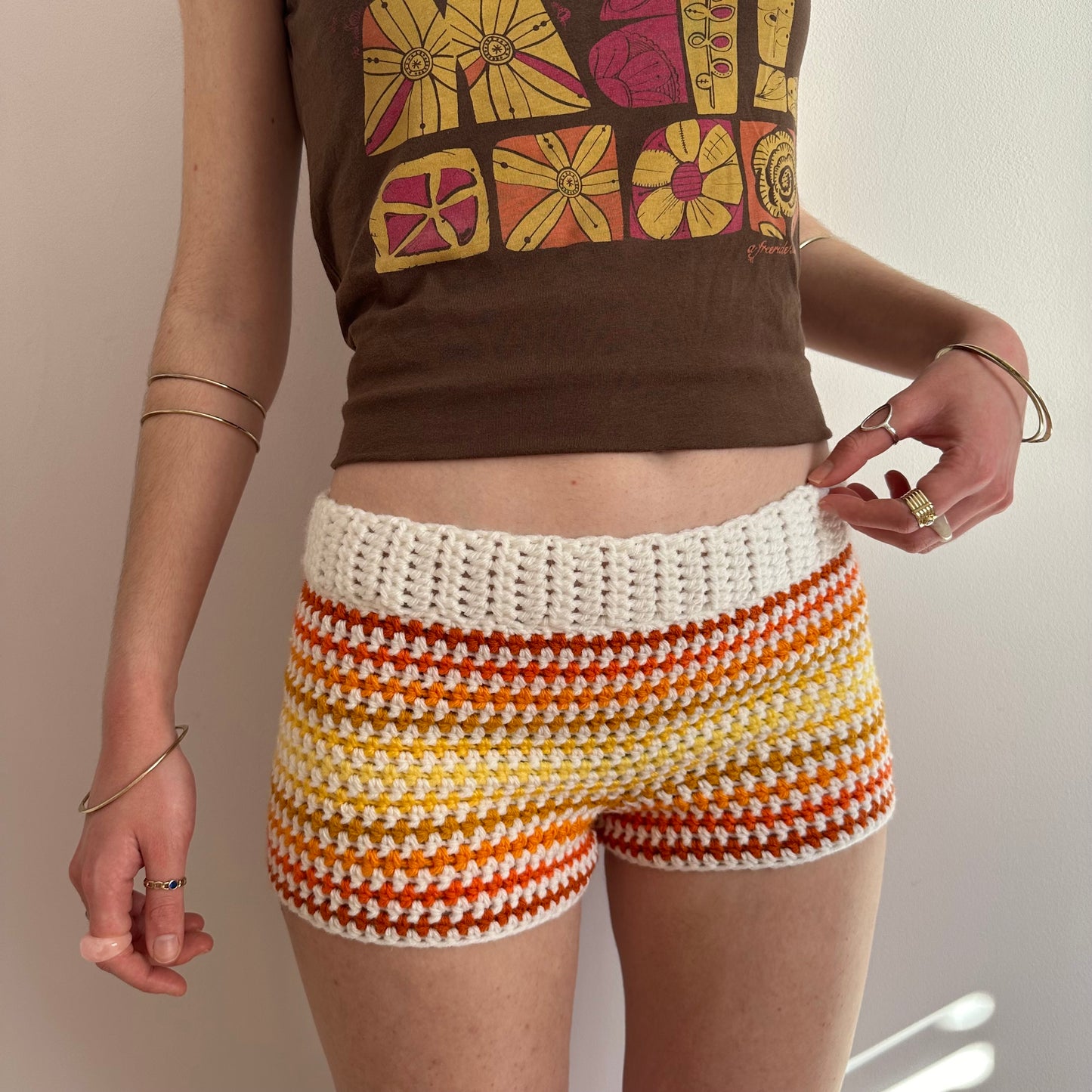 Handmade white, orange and yellow ombré striped crochet shorts