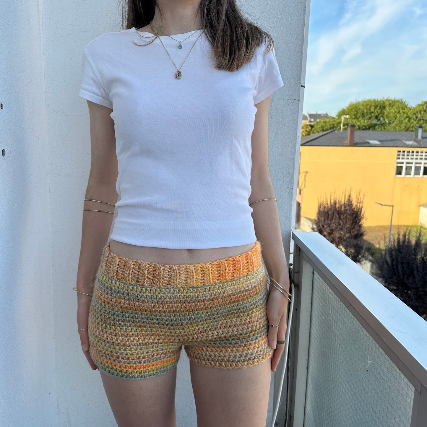 Handmade grey, yellow and orange ombré striped crochet shorts