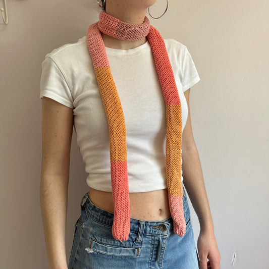 Handmade knitted colour block skinny scarf in coral and orange