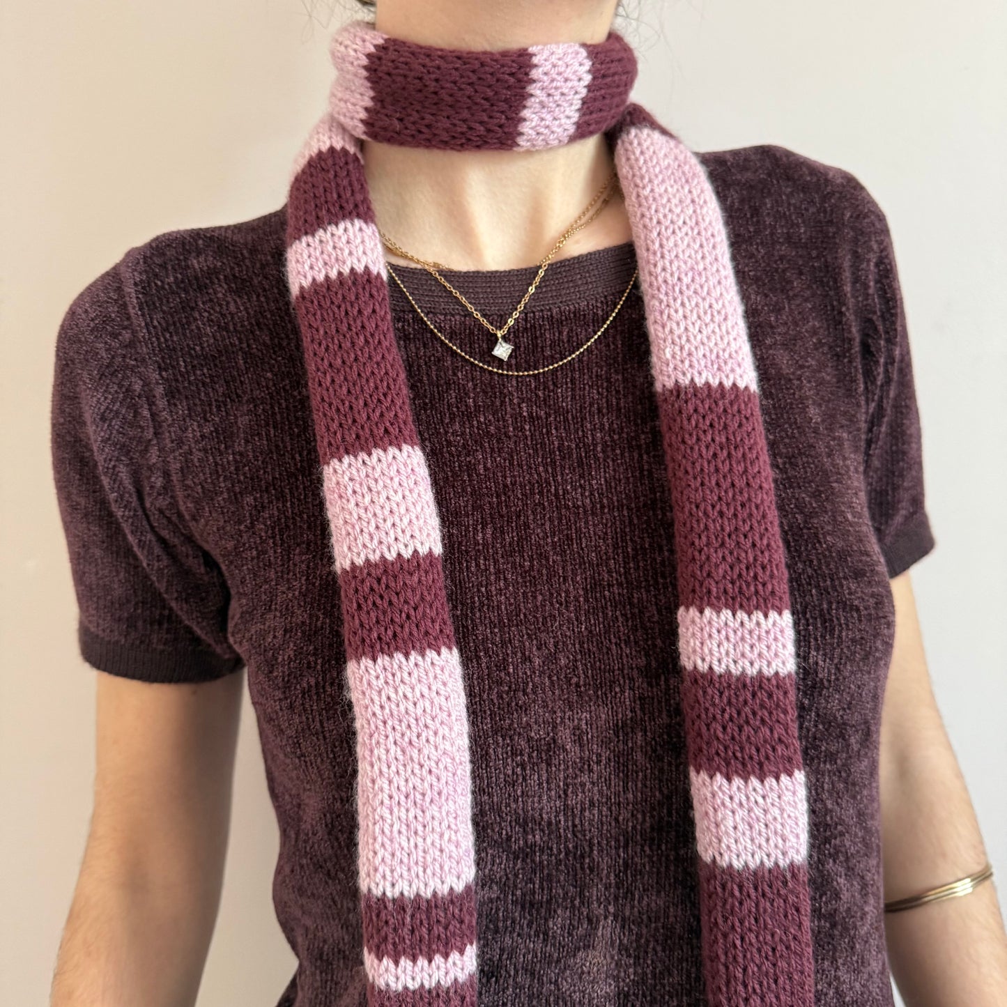 Handmade knitted stripy skinny scarf in maroon and dusky pink