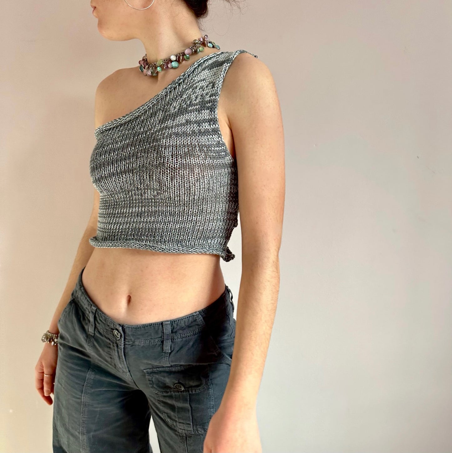 Handmade knitted metallic asymmetrical one shoulder top in silver and grey