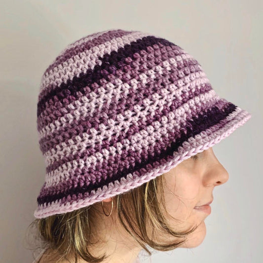 Handmade striped crochet bucket hat in purple shades