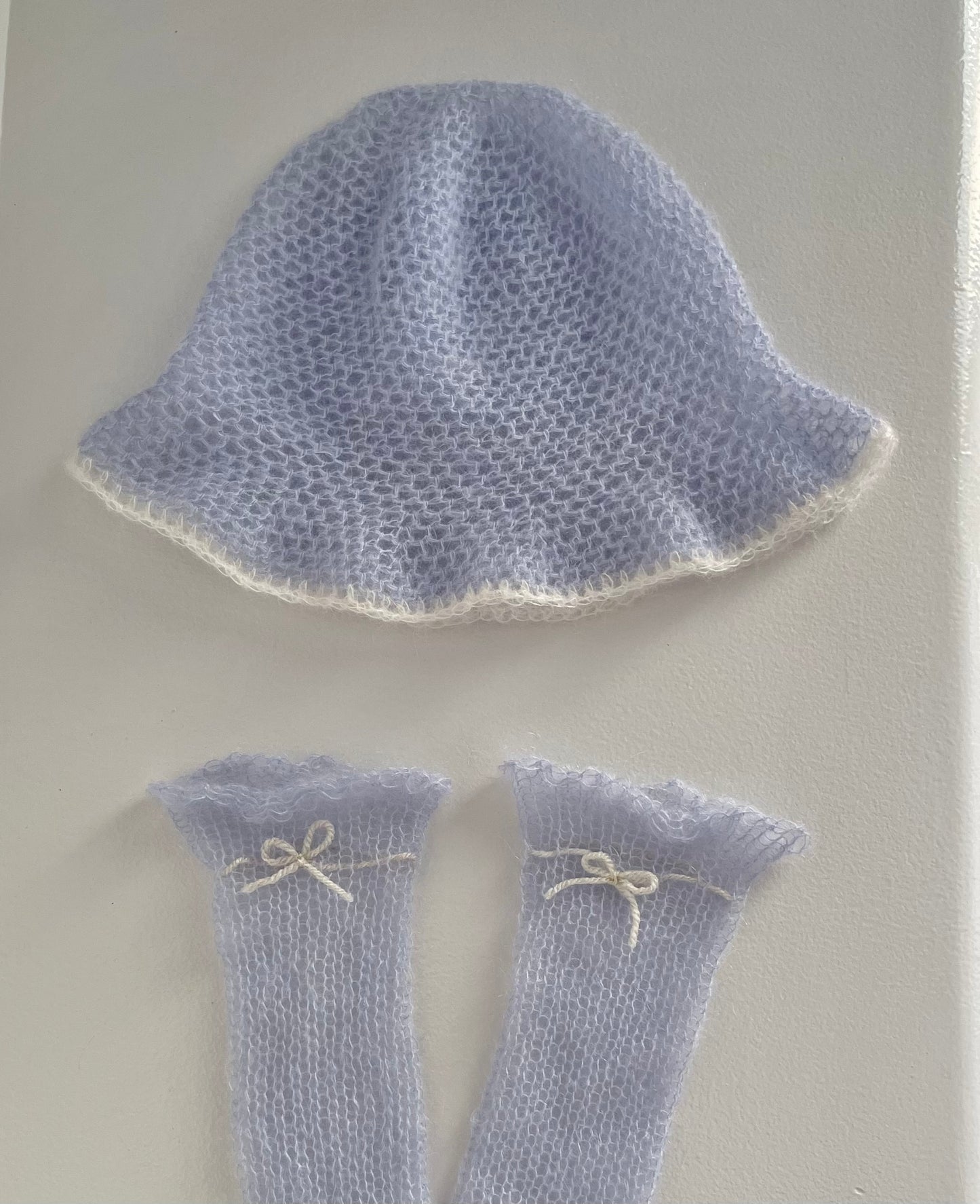 Handmade crochet mohair bucket hat in baby blue with cream trim