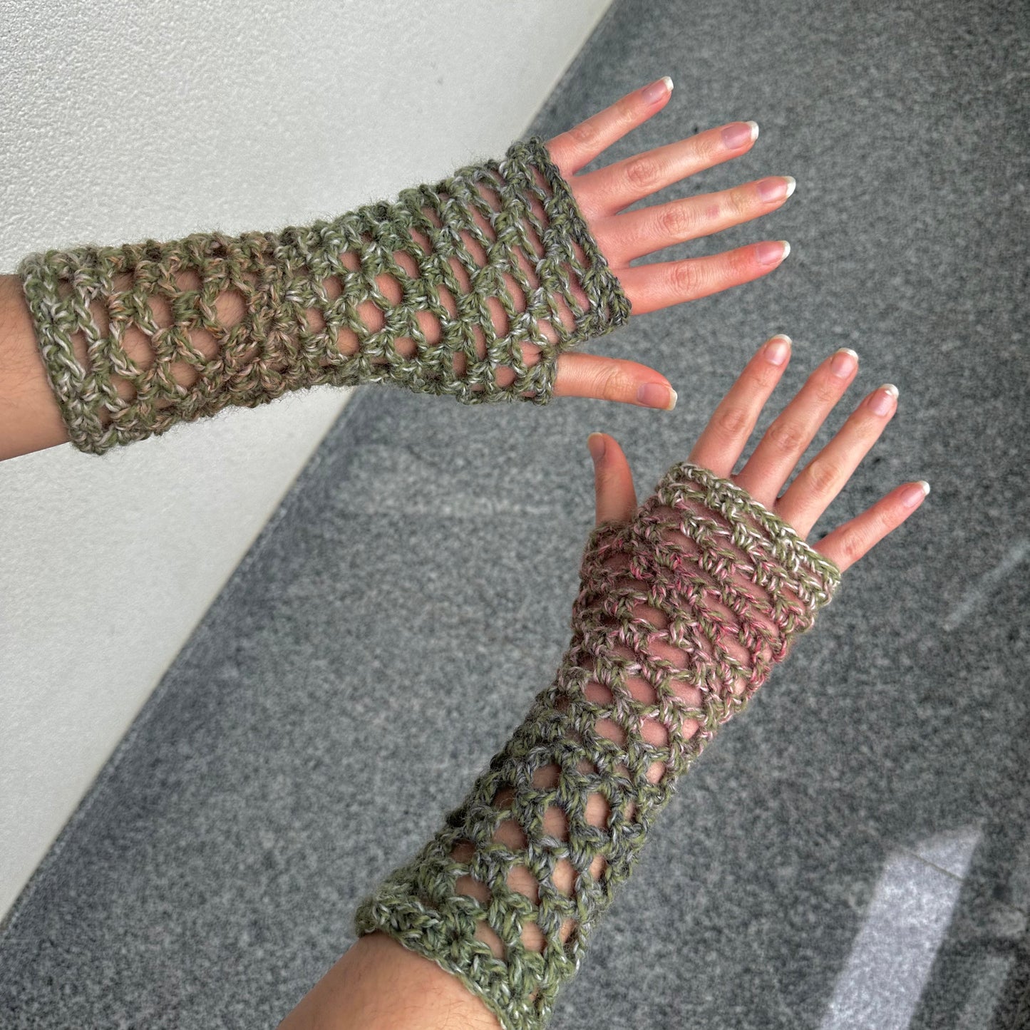 Handmade dusky pink and green crochet fishnet hand warmers